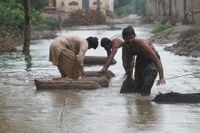 Rescue boat capsizes in Pakistan floods, killing at least nine