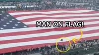 NFL Game Turns Into Comedy Show As Fan Gets Stuck In Giant American Flag During National Anthem