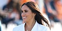 Meghan Markle Wears Dramatic White Cape to First Paris Fashion Week
