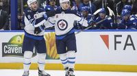 Jets forward Nikolaj Ehlers departs after colliding with an official in the second period