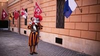 A look at Swiss Guards preparing for a swearing-in ceremony attended by the Pope, in photos
