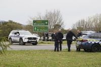 Australian police hunt for gunman who killed 2 officers and shot another in a rural town