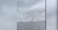 Explosion on cargo ship near Baltimore's Key Bridge prompts U.S. Coast Guard response