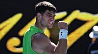Australian Open: Carlos Alcaraz overcomes an early stutter to beat Yannick Hanfmann and continue his bid for a career Grand Slam