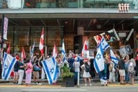 TIFF and director of Oct. 7 documentary reach agreement, with film back in festival