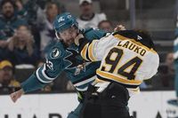 Sharks break late tie, extend Bruins' skid