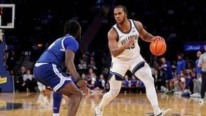 Lakers Sign Eric Dixon To Two Way Contract After NCAA Scoring Title