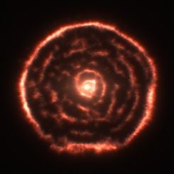 A Spiral Nebula Surrounding Star R Sculptoris