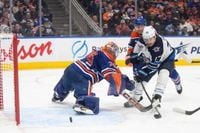 Jets rebound with win over Oilers, reach 100-point milestone