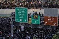 Photos show thousands of ultra-Orthodox men protesting military draft shut down Jerusalem