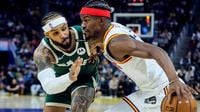 Butler scores 24 and Warriors win without Curry, 104-93 over Bucks