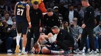 Nuggets' Jokic limps off court after injuring knee