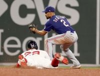 Rangers' bats come alive with new coach Boone in dugout