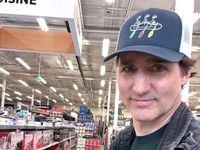 Trudeau takes a selfie while shopping for utensils after Carney becomes PM