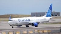 A passenger says a United pilot forcibly removed him from an airplane bathroom. Now he is suing