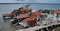 Matmo weakens into a storm after blowing across northern Philippines