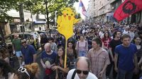Thousands rally in Serbia and accuse police of brutality at anti-government demonstrations