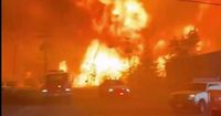 Residents evacuated as huge fire tears through community 'like a war zone'