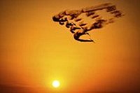 Photos of a display of aerobatics and military air power at the Bucharest International Air Show