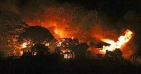 Fire burning in southwestern Japan damages 170 homes and forces evacuations