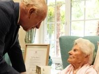 King Charles meets with the world's oldest person and listens as she gushes about his youth - Royal Central