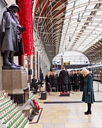 Queen Camilla takes poppies to Paddington on Armistice Day