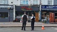 Boy and man held over restaurant 'arson attack'