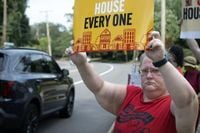 Protesters deliver letter to Hill’s door opposing cuts to federal programs | Northwest Arkansas Democrat-Gazette