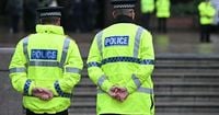 Britain arrests three people for spying for Russia