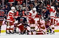 Red Wings soar past Jets thanks to J.T. Compher, John Gibson