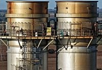 Eight arrests after Greenpeace campaigners climb chimney stacks at power station