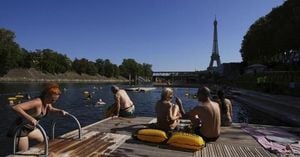 Parisians Flock To Seine As Swimming Returns Amid Heatwave