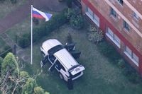 Man charged after SUV crashes into gate of Russian consulate in Sydney