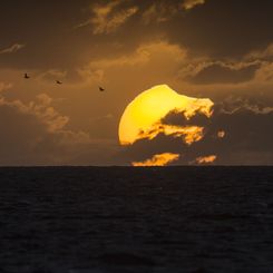  A Partially Eclipsed Setting Sun 