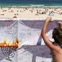 Australia falls silent, lights candles for Bondi Beach shooting victims