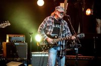 Neil Young, Joan Baez & Maggie Rogers Perform at ‘Fighting Oligarchy’ Rally