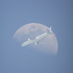  An Airplane in Front of the Moon 