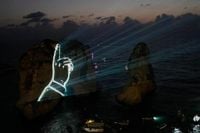 Hezbollah defies Lebanon PM's ban to honor fallen leaders with coastal light show