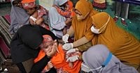 Photos show the efforts to curb a measles outbreak in Indonesia