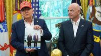 Trump holds up photo sent to him by Putin: 'I'm going to sign this for him'