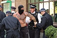 Arrests at anti-migrant protest as ‘Pink Ladies’ march on Canary Wharf hotel