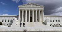Trump says US would be on 'brink of economic catastrophe' unless justices rule his tariffs are legal