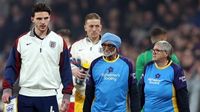 England and Wales players walk out with mascots with dementia