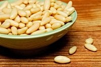 Pine nuts and goats milk should be on food allergy lists, researchers say