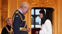 Claudia Winkleman delightedly accepts MBE from King Charles at Windsor