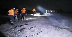 Rescue Teams Search For Man Swept Away In Flood