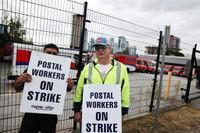 Postal workers walk the picket line in Surrey