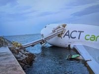 Two killed as cargo plane skids off Hong Kong runway