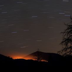 Fire Glow and Star Trails at Sunset Crater