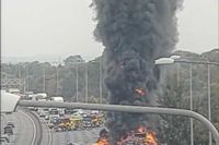 Major motorway closed as lorry erupts in flames with black smoke billowing into sky